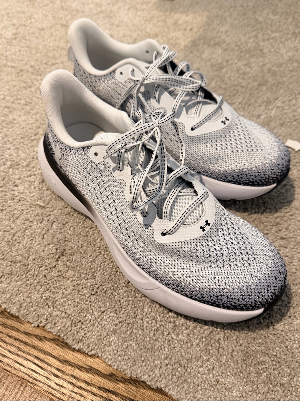 Under Armour men’s White and black Running Sneakers